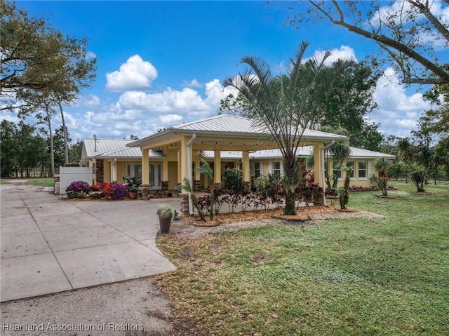 view of vehicle parking featuring a carport and french doors