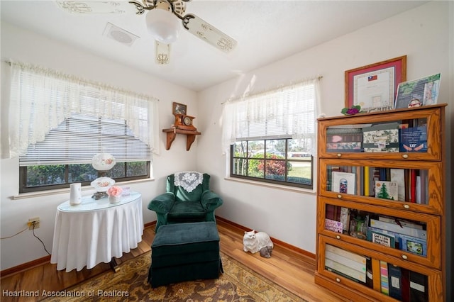 sitting room featuring wood-type flooring