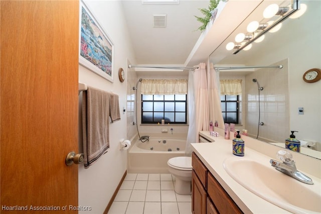 full bathroom with tile patterned floors, toilet, shower / bath combo with shower curtain, and vanity