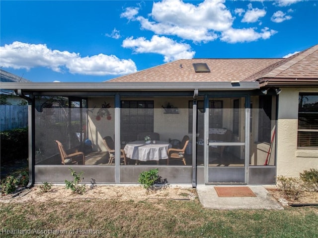 back of property featuring a sunroom