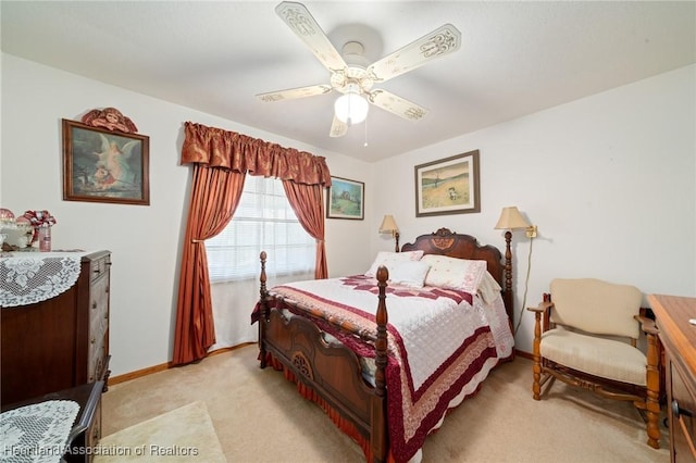 bedroom featuring ceiling fan and light carpet