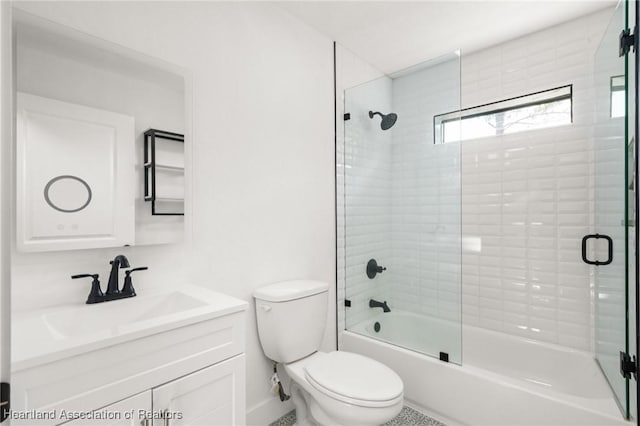 111 Blue Moon Ave, Lake Placid, FL 33852 - bathroom featuring toilet, vanity, combined bath / shower with glass door, and baseboards