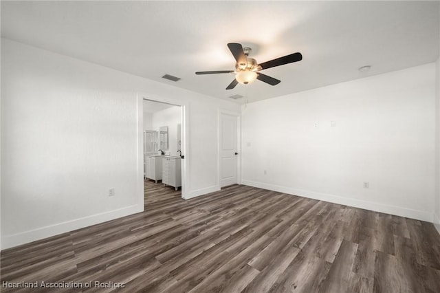 111 Blue Moon Ave, Lake Placid, FL 33852 - unfurnished bedroom with dark wood-style flooring, baseboards, and ceiling fan