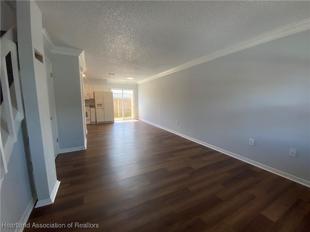 unfurnished living room with a textured ceiling, crown molding, and dark wood-type flooring