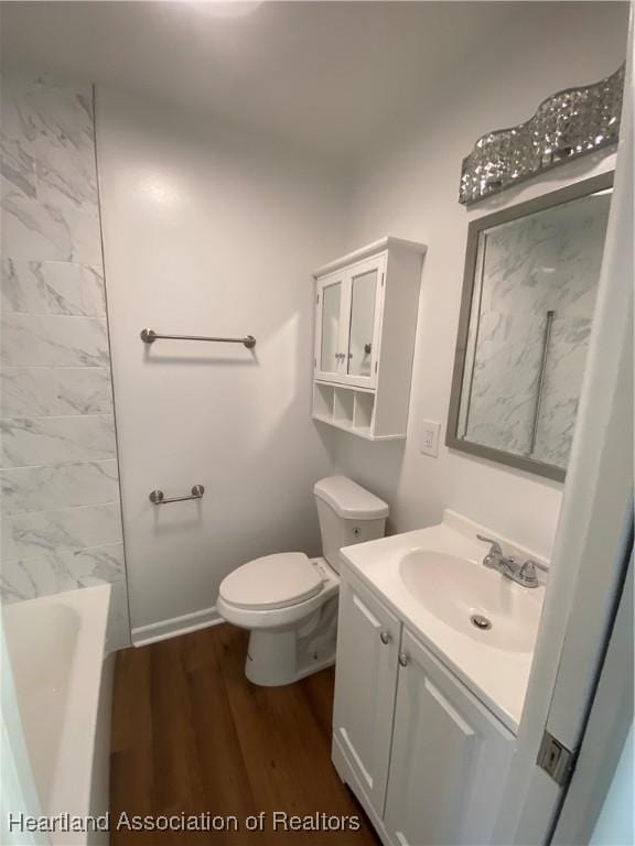 full bathroom with shower / tub combination, hardwood / wood-style floors, vanity, and toilet