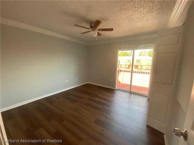 empty room with ornamental molding, ceiling fan, dark hardwood / wood-style floors, and a textured ceiling