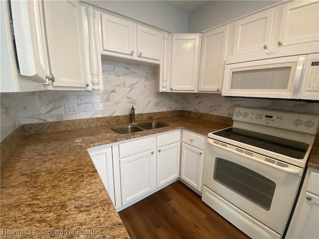 kitchen featuring white appliances, white cabinetry, and sink