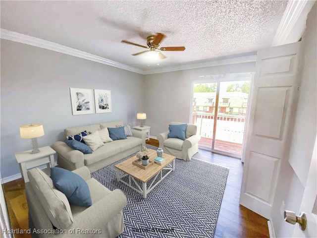 living room with hardwood / wood-style floors, ceiling fan, crown molding, and a textured ceiling