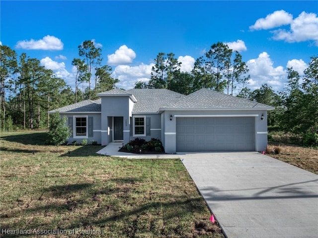 ranch-style house featuring concrete driveway, a front lawn, an attached garage, stucco siding, and roof with shingles