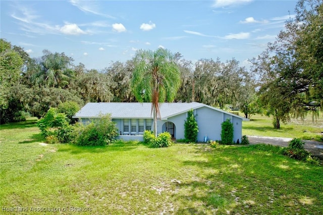 ranch-style house with a front lawn