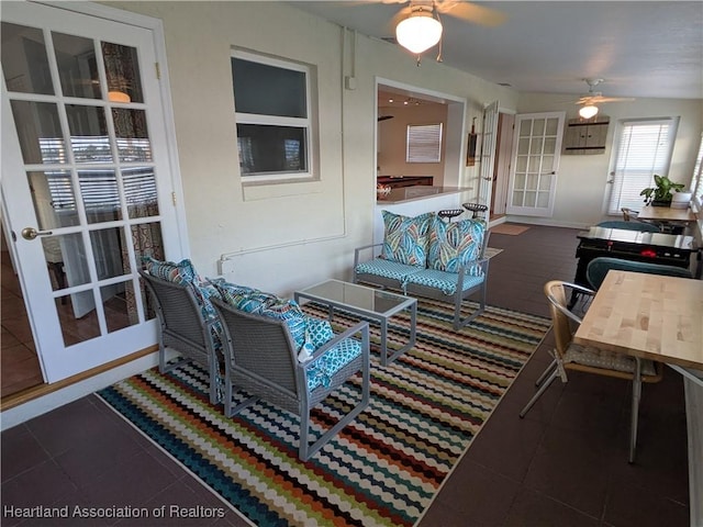 tiled living room featuring ceiling fan