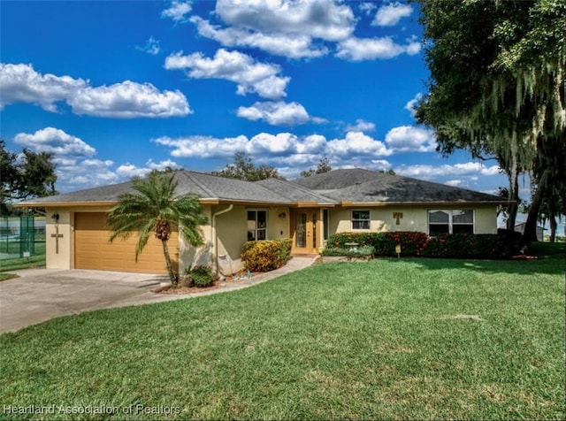 single story home with a front yard and a garage