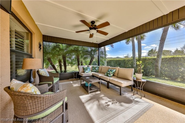 sunroom with ceiling fan