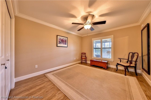 unfurnished room featuring hardwood / wood-style floors, ceiling fan, and ornamental molding