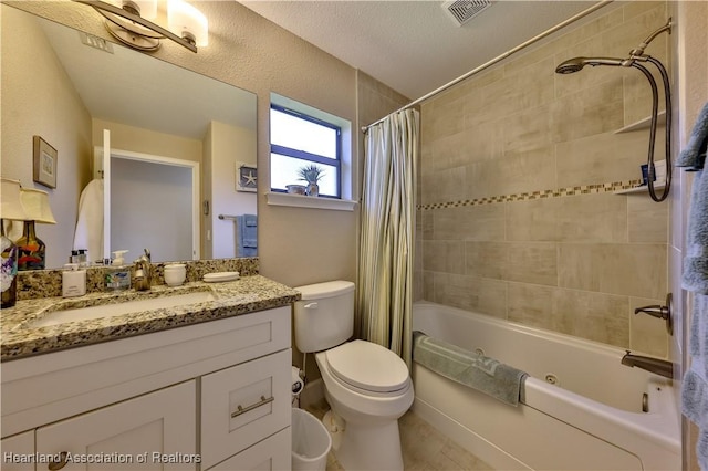 full bathroom with shower / tub combo with curtain, vanity, and toilet