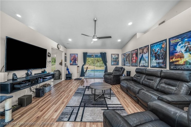 living area with wood finished floors, lofted ceiling, visible vents, ceiling fan, and recessed lighting