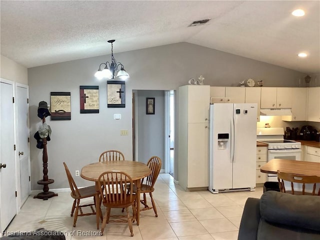 dining space with lofted ceiling, visible vents, light tile patterned flooring, a textured ceiling, and a chandelier