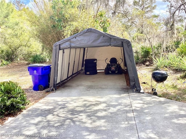 exterior space featuring a detached carport and driveway