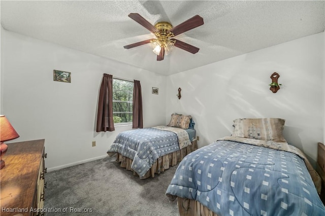 bedroom featuring a textured ceiling, carpet floors, and ceiling fan