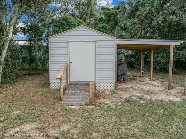 view of outdoor structure with a carport