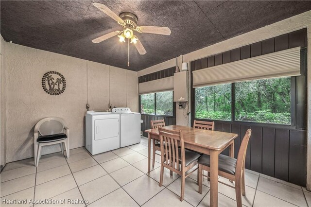 tiled dining area featuring ceiling fan and washer and clothes dryer