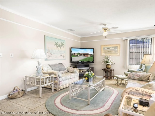 tiled living room featuring ceiling fan and ornamental molding