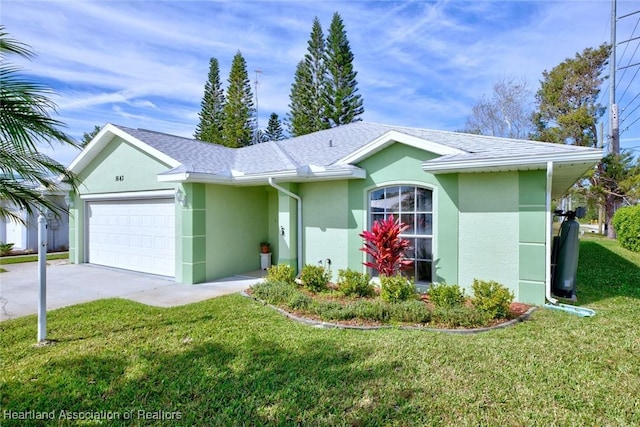 single story home featuring a garage, driveway, a front lawn, and stucco siding