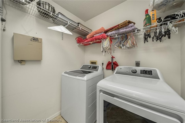 washroom with washing machine and clothes dryer