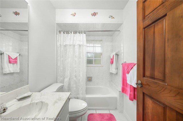 full bathroom featuring tile patterned flooring, vanity, toilet, and shower / tub combo with curtain