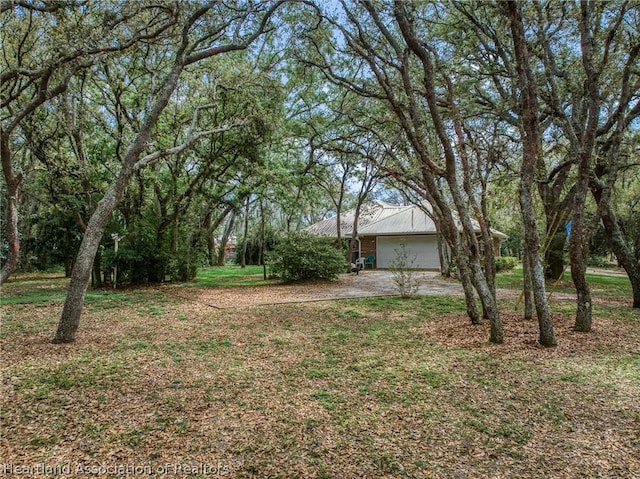 view of yard with a garage