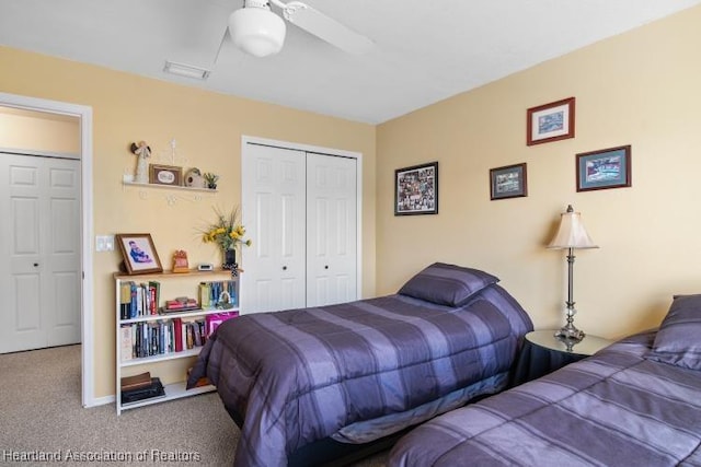 bedroom with carpet floors, a ceiling fan, visible vents, and a closet