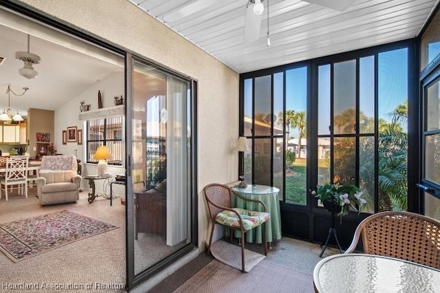 sunroom / solarium with vaulted ceiling