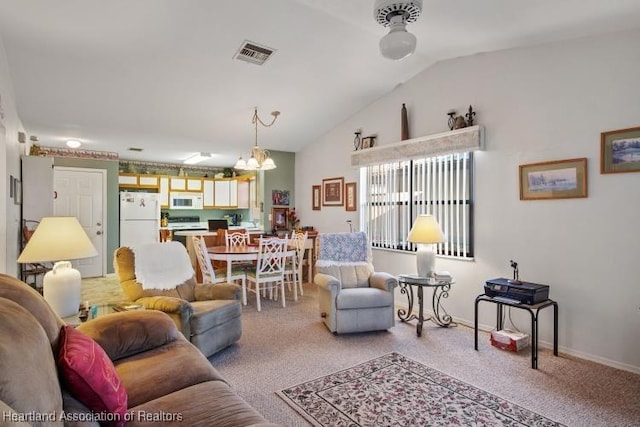 living area with lofted ceiling, baseboards, visible vents, and carpet flooring