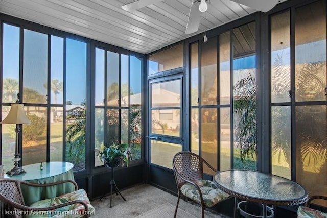 sunroom / solarium featuring ceiling fan