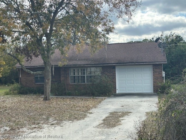 single story home featuring a garage