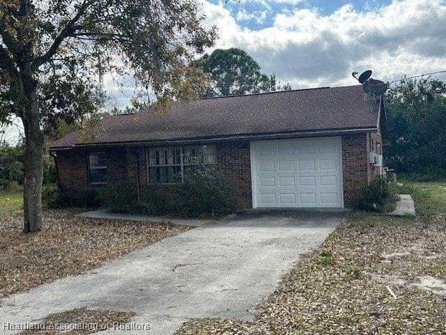 single story home featuring a garage