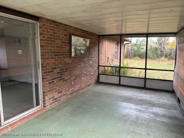 unfurnished sunroom featuring a healthy amount of sunlight