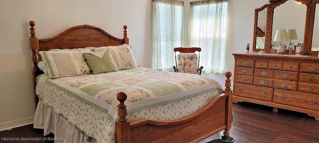 bedroom featuring dark hardwood / wood-style flooring