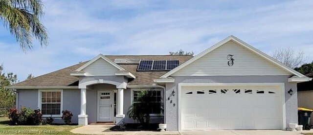 view of front of home featuring solar panels