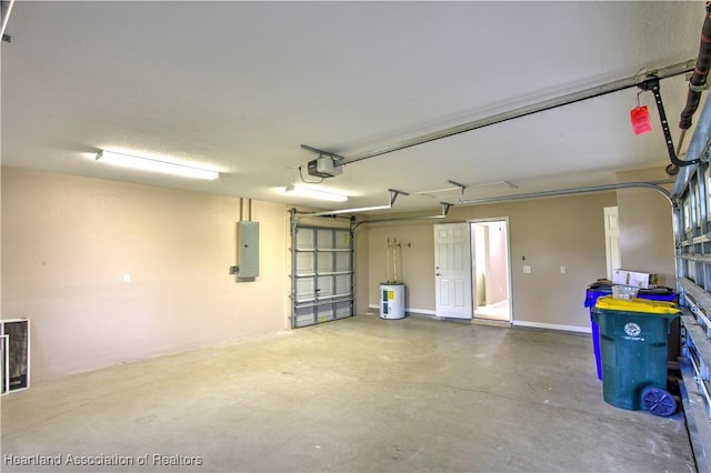 garage featuring electric panel, a garage door opener, and baseboards