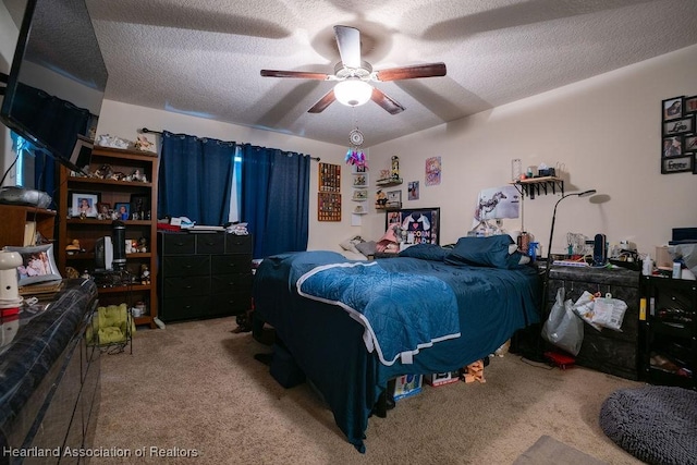 297 NE Glentry Ave NE, Port St Lucie, FL 34983 - carpeted bedroom featuring a textured ceiling and a ceiling fan