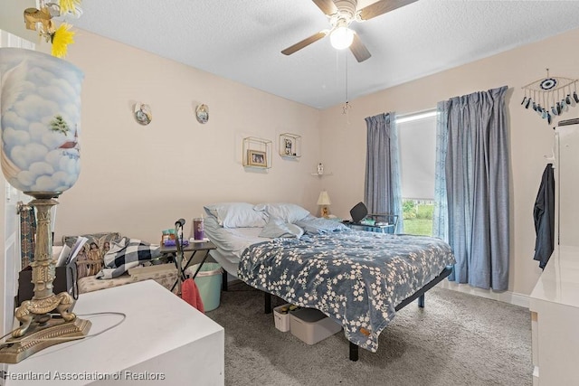 297 NE Glentry Ave NE, Port St Lucie, FL 34983 - bedroom featuring ceiling fan, carpet, and a textured ceiling
