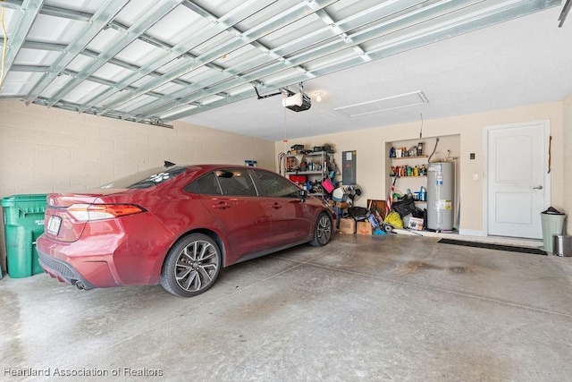 297 NE Glentry Ave NE, Port St Lucie, FL 34983 - garage featuring electric water heater, a garage door opener, and electric panel