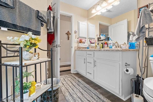 297 NE Glentry Ave NE, Port St Lucie, FL 34983 - bathroom with vanity and wood finished floors