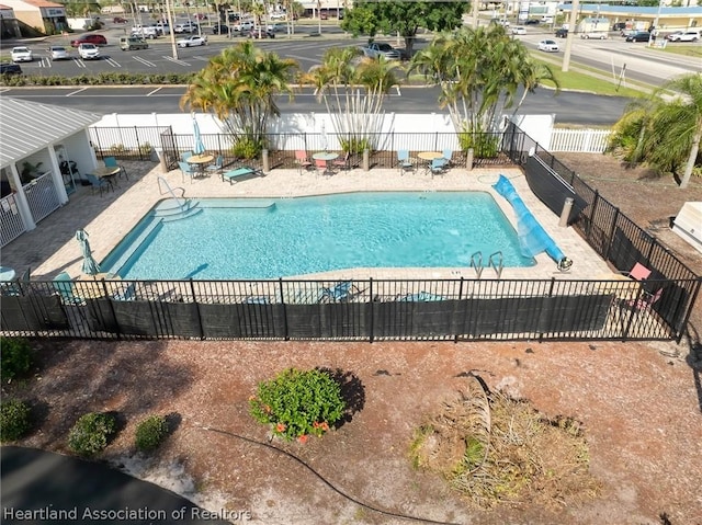 view of swimming pool with a patio