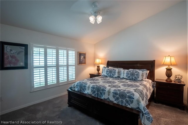 carpeted bedroom featuring ceiling fan and vaulted ceiling