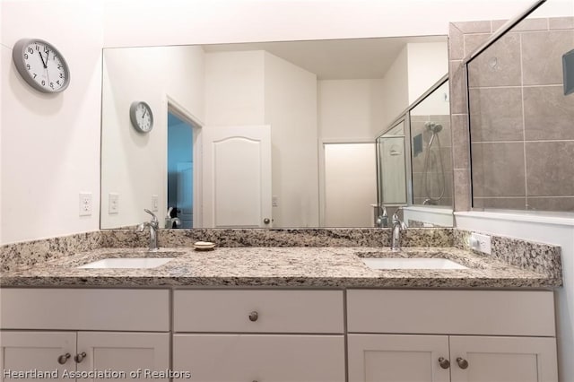 bathroom with vanity and an enclosed shower