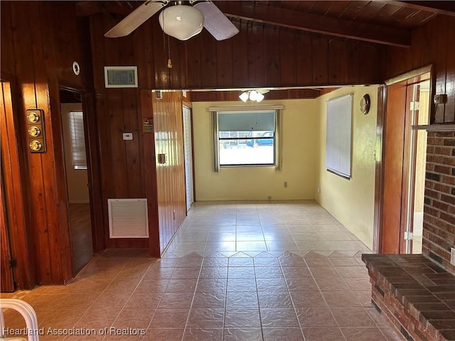 11 Mockingbird Rd, Lake Placid, FL 33852 - tiled spare room featuring wooden walls, ceiling fan, and wood ceiling