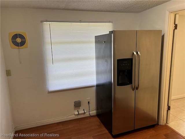 11 Mockingbird Rd, Lake Placid, FL 33852 - kitchen featuring stainless steel fridge with ice dispenser, healthy amount of natural light, and wood finished floors