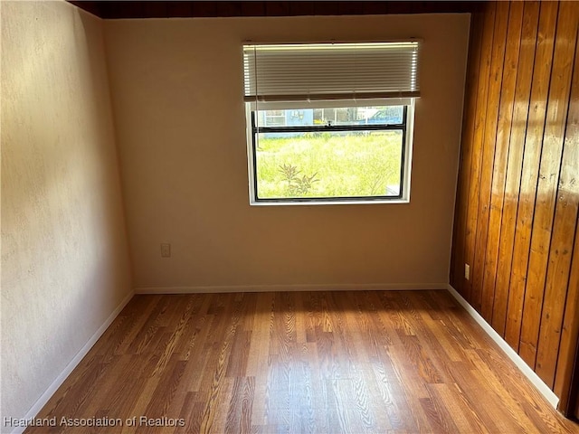 11 Mockingbird Rd, Lake Placid, FL 33852 - unfurnished room with wood finished floors and baseboards